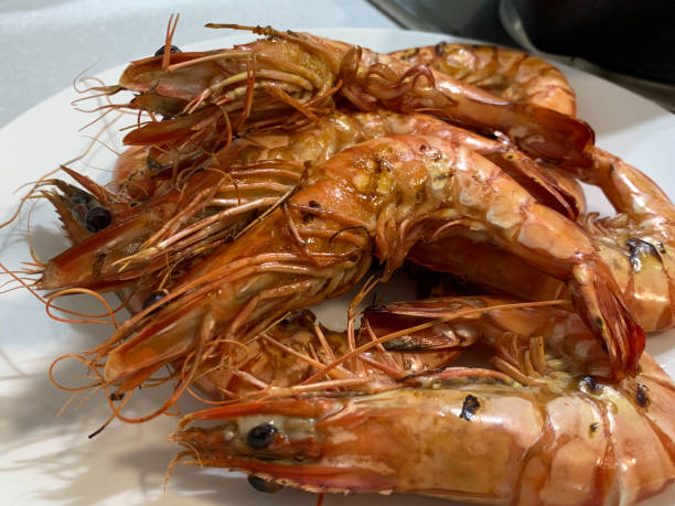 istock Prawn or tiger shrimp grilled on white plate. (selective focus) 1220319894