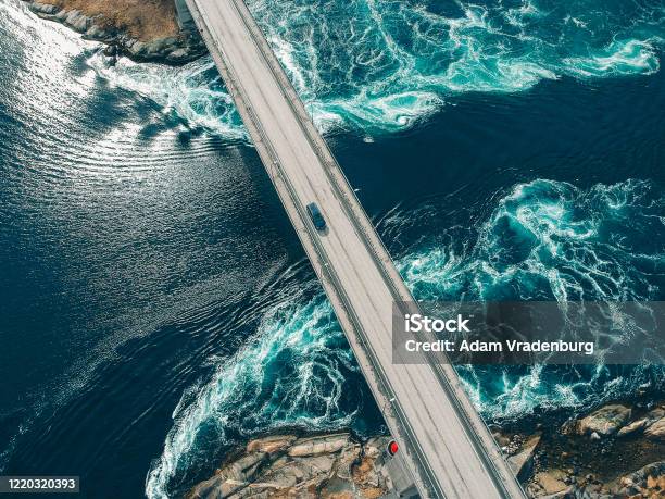 Car Traversing Bridge With Water Torrents Beneath Stock Photo - Download Image Now - Sustainable Resources, Renewable Energy, Transportation