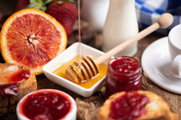 istock Breakfast with bred, honey strawberries jam 1220320491