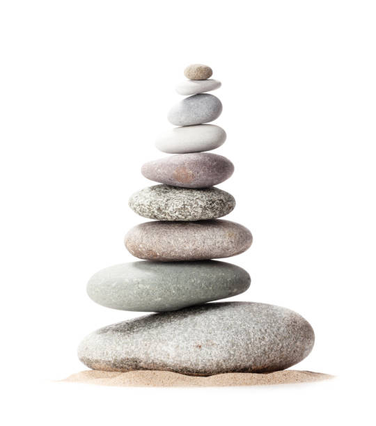 istock Pyramid of sea pebbles. Isolated on white 1220321450
