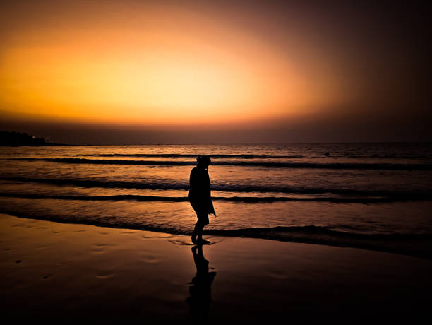 istock Evening walk by the sea 1220322119