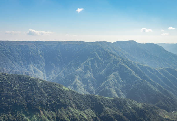 istock misty mountain range covered with white mist and amazing blue sky 1220325286