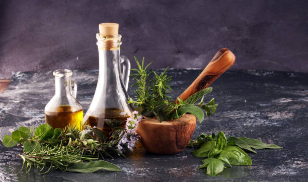 istock Homegrown and aromatic herbs on rustic background with rosemary and basil 1220325849