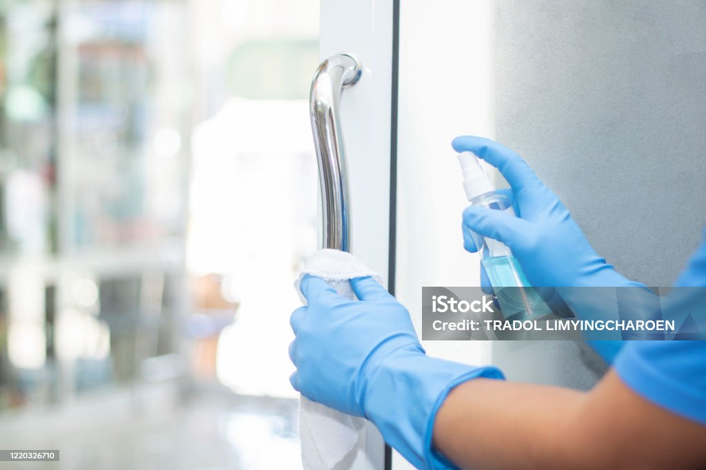 sanitizer spray clean handle door protect virus bacteria corona 2019 Cleaning Stock Photo