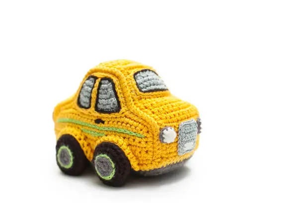 Photo of Small knitted yellow baby car