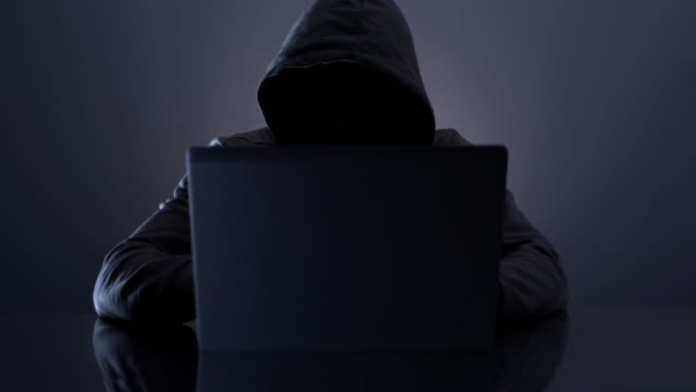 Hooded hacker. Cyber crime.