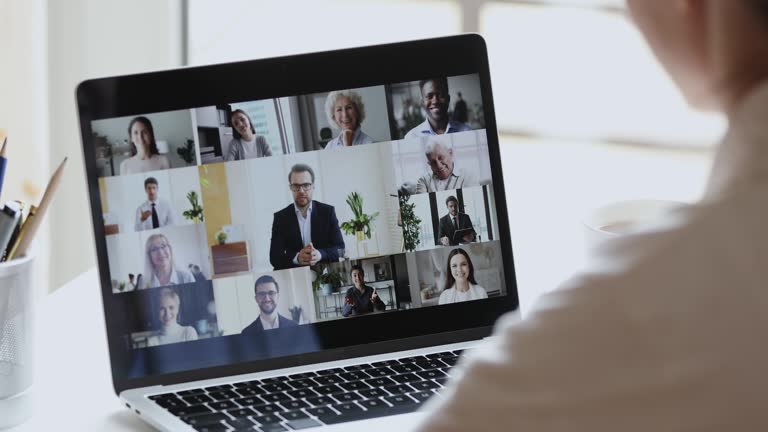 Business woman video conferencing boss and colleagues by online call