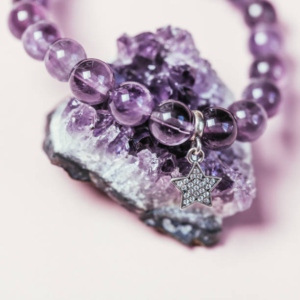 istock Various semiprecious bracelets on pink background. 1220331435