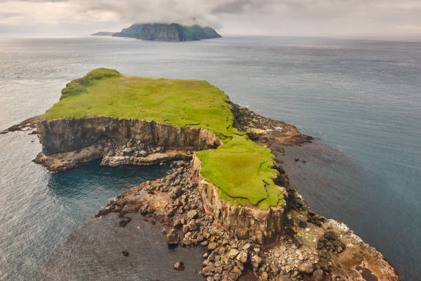 istock Faroe islands dramatic coastline viewed from helicopter. Vagar flight 1220332485