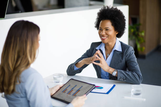 istock Successful businesswomen working together on project using digital tablet 1220332599