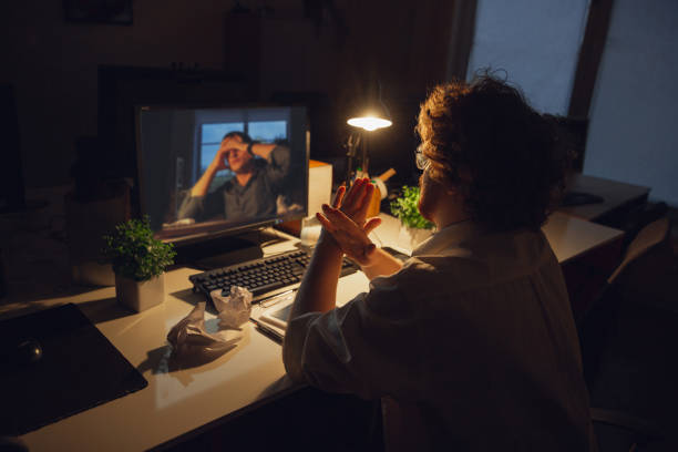 istock Man working in office alone during coronavirus or COVID-19 quarantine, staying to late night 1220334325
