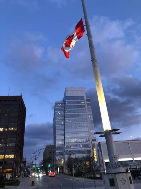 istock Canadian Flag Flying at Half-Mast Over Windsor, Ontario 1220334870