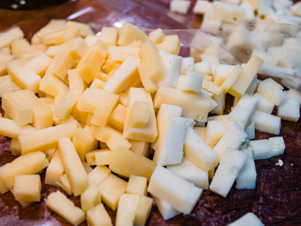 close-up of the typical cheeses used in the recipe for making pizzoccheri. typical dish from valtellina, lombardy, italy. - pizzoccheri homemade tagliatelle italy imagens e fotografias de stock