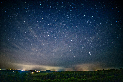 Light pollution bounces off low lying clouds over south Devon