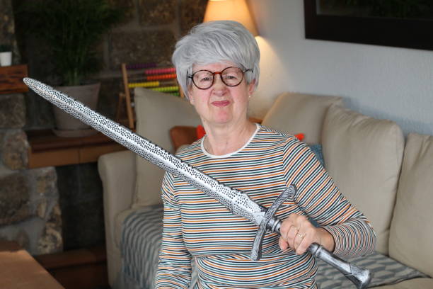 Senior woman holding a sword