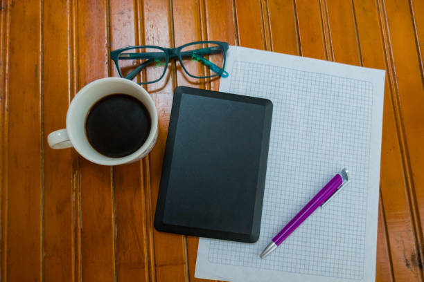 istock A tablet on a desk at work with coffee, pen and paper 1220341600