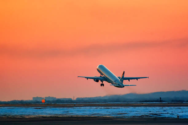 Takeoff of the plane at sunset