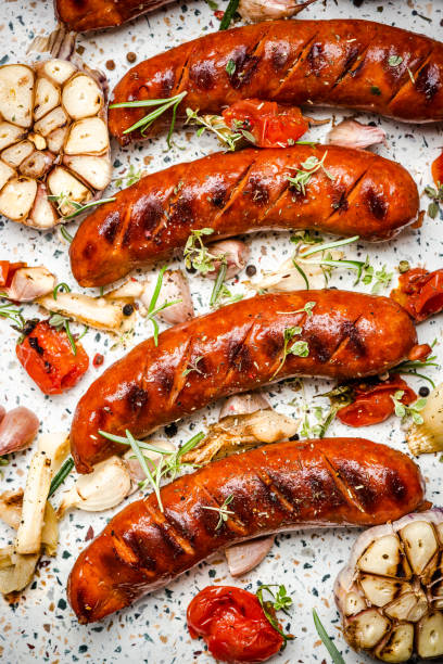 istock Serving Grilled Barbecue Sausage with BBQ Vegetables and Herbs 1220344217