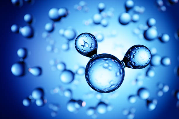 istock 3d render: Models of H2O water molecules in front of blue background. Selective focus on foreground 1220344849