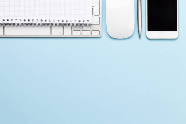 istock Blue workplace with computer, supplies and smartphone 1220346629
