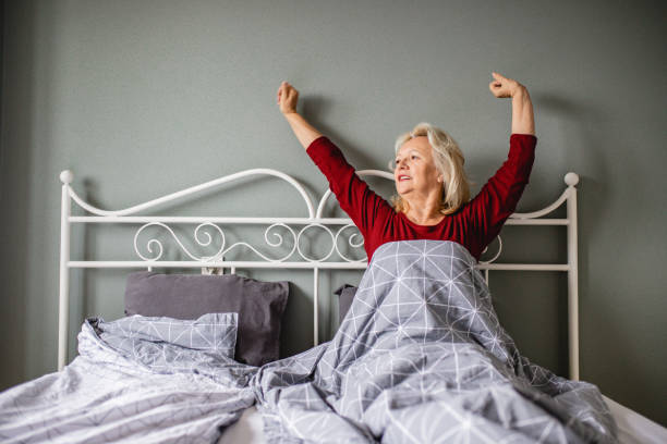 istock Senior woman waking up 1220346770