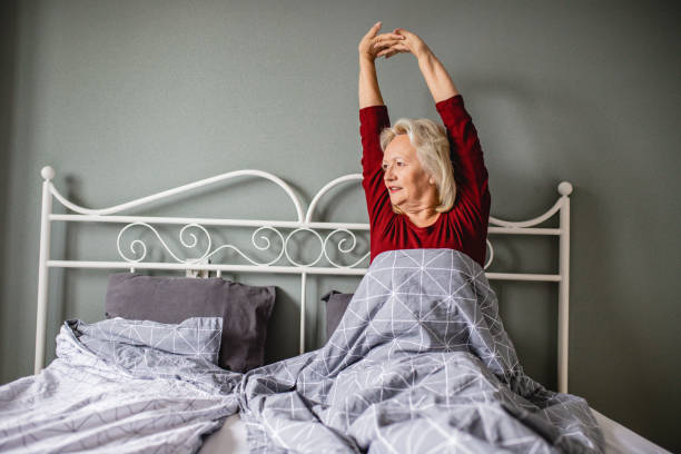 istock Senior woman waking up 1220346774