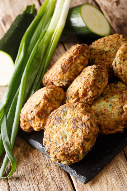 istock Zucchini balls with ingredients close-up on a slate board. vertical 1220350205