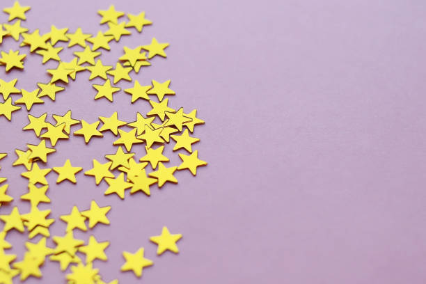 istock Golden stars glitter on pink background. 1220350602