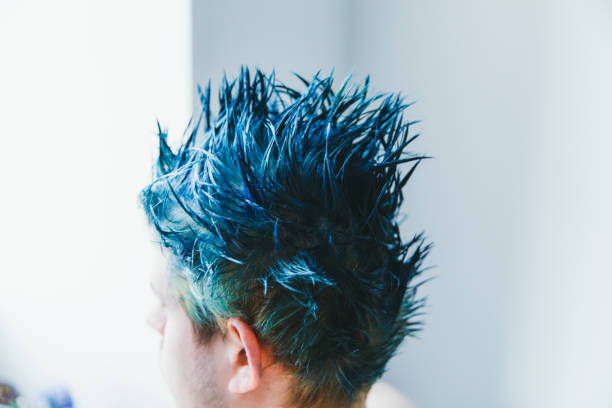 decided to have more colors in his life and dye hair with bright blue during staying at home - blue tint imagens e fotografias de stock