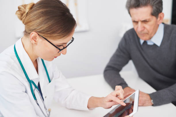 istock Doctor looking at examination results on the digital tablet 1220352359