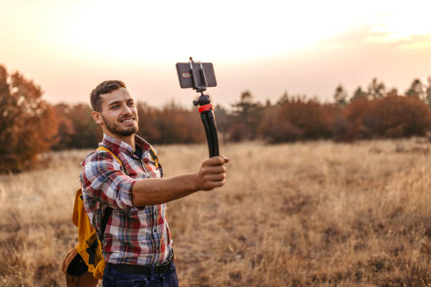 istock Man vlogging and having fun in nature 1220352748