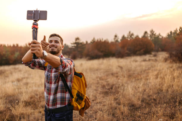 istock Man vlogging and having fun in nature 1220352791