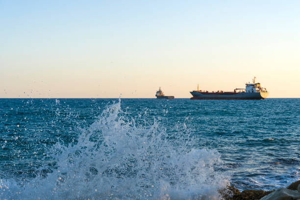 корабль в средиземном море у берегов кипра. - barge beach large blue стоковые фото и изображения