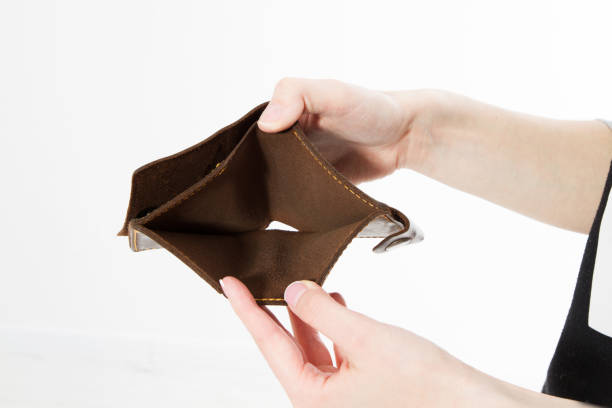 istock Hand with an empty wallet isolated on white background, Bankruptcy 1220355062
