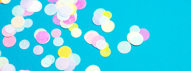 istock A banner for a turquoise website with multi-colored confetti. 1220356546
