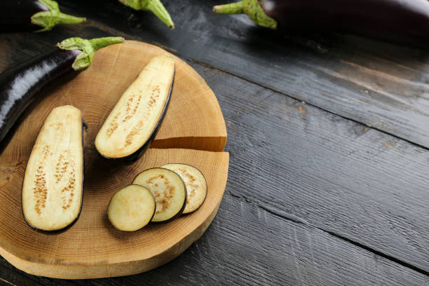 istock Uncooked vegetable washed clean. Top view of raw eggplant. 1220358761