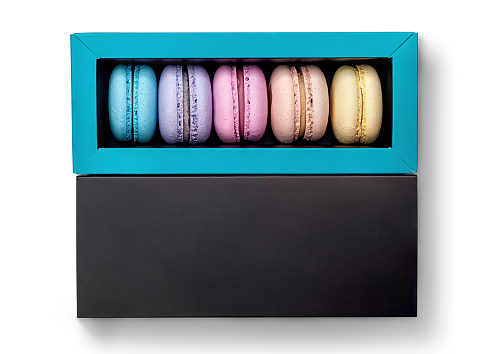 French macaroon in box top view on white background