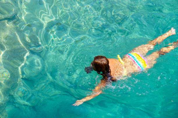 istock Woman floating in the clean sea. 1220359152