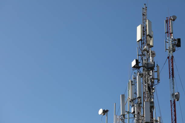 istock Mobile towers on blue sky background. Many communication equipment. 1220359203