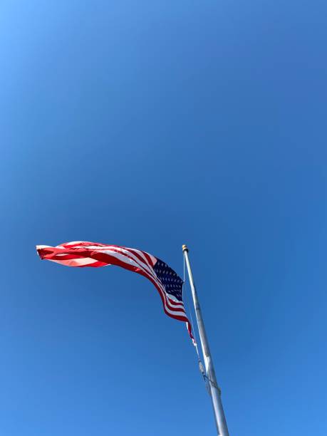 istock American Flag Flying on Windy Day 1220365935