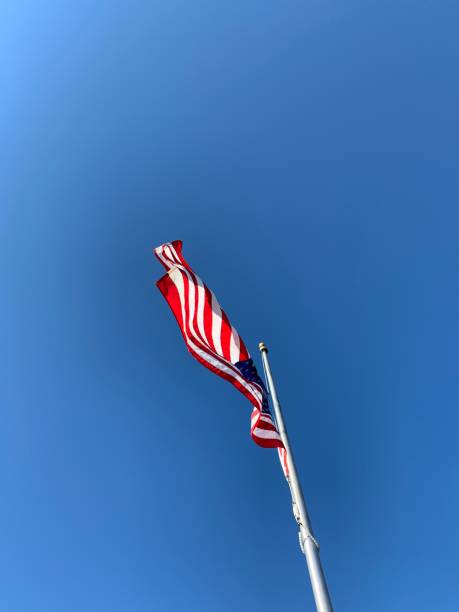 istock American Flag Flying on Windy Day 1220365944