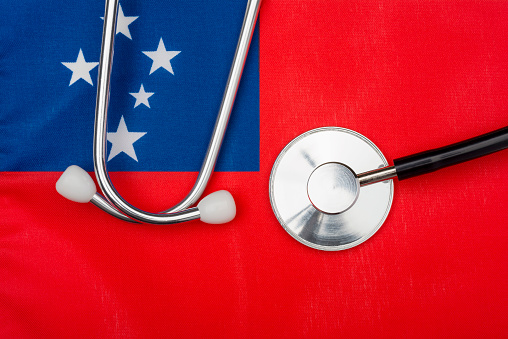 Flag of Samoa and stethoscope. The concept of medicine. Stethoscope on the flag in the background.