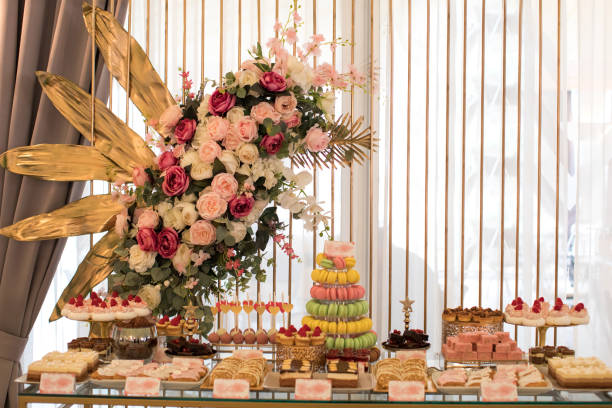 istock Delicious cake pops, cupcakes, macarons and other sweets on table 1220367778