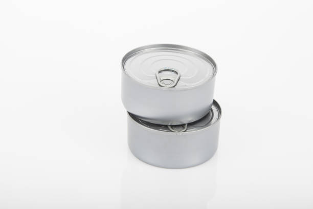 istock two cans of tuna on white background 1220369436