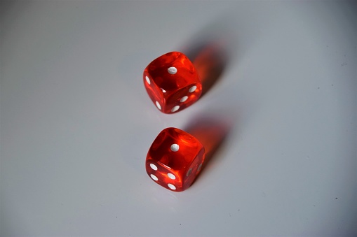 Red dice pair on white background one and one
