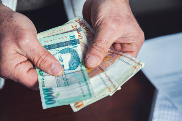 istock man hand holding money 1220369586
