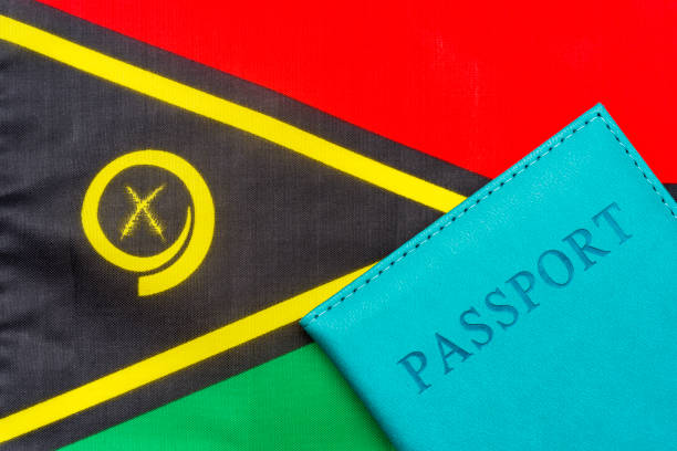 On the background of the flag of Vanuatu is a passport. On the background of the flag of Vanuatu is a passport. The concept of travel and tourism. vanuatu stock pictures, royalty-free photos & images
