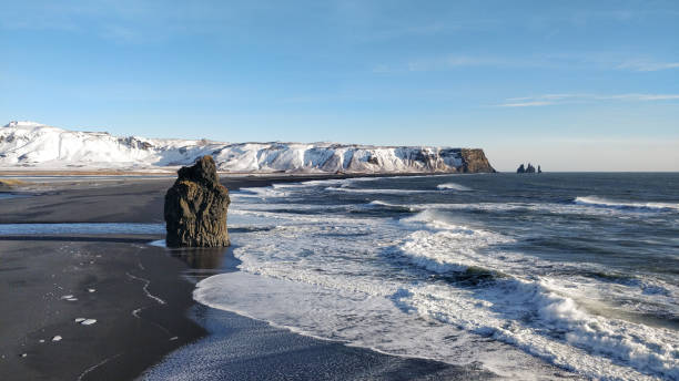 istock Famous vulcanic black sand Reynisfjara Beach in winter 1220376381