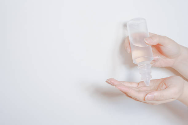 istock clean and protect COVID-19 virus activity from woman hand during use alcohol gel with white isolated background 1220376426