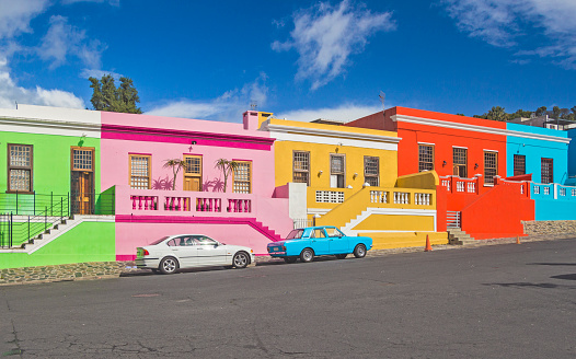 South Africa - Cape Town - Colorful multicolored houses, cottages and cars on steep street in Bo-Kaap borough, one of Cape Town's symbol